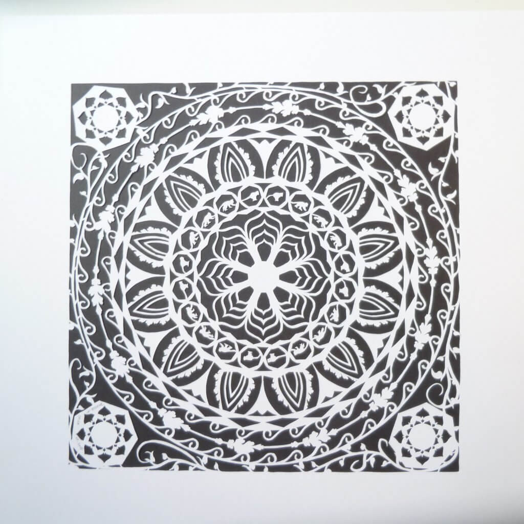 Cutout completed : papercut mandala white on black version